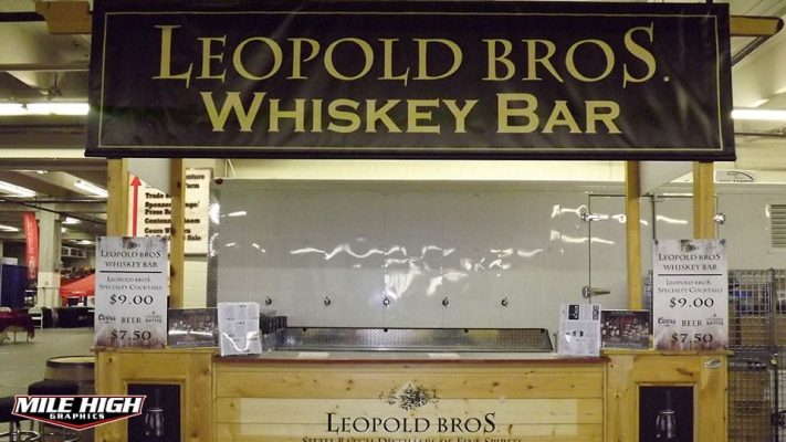 Photo of indoor banner hanging on beverage stand by Mile High Graphics for Leopold Whiskey